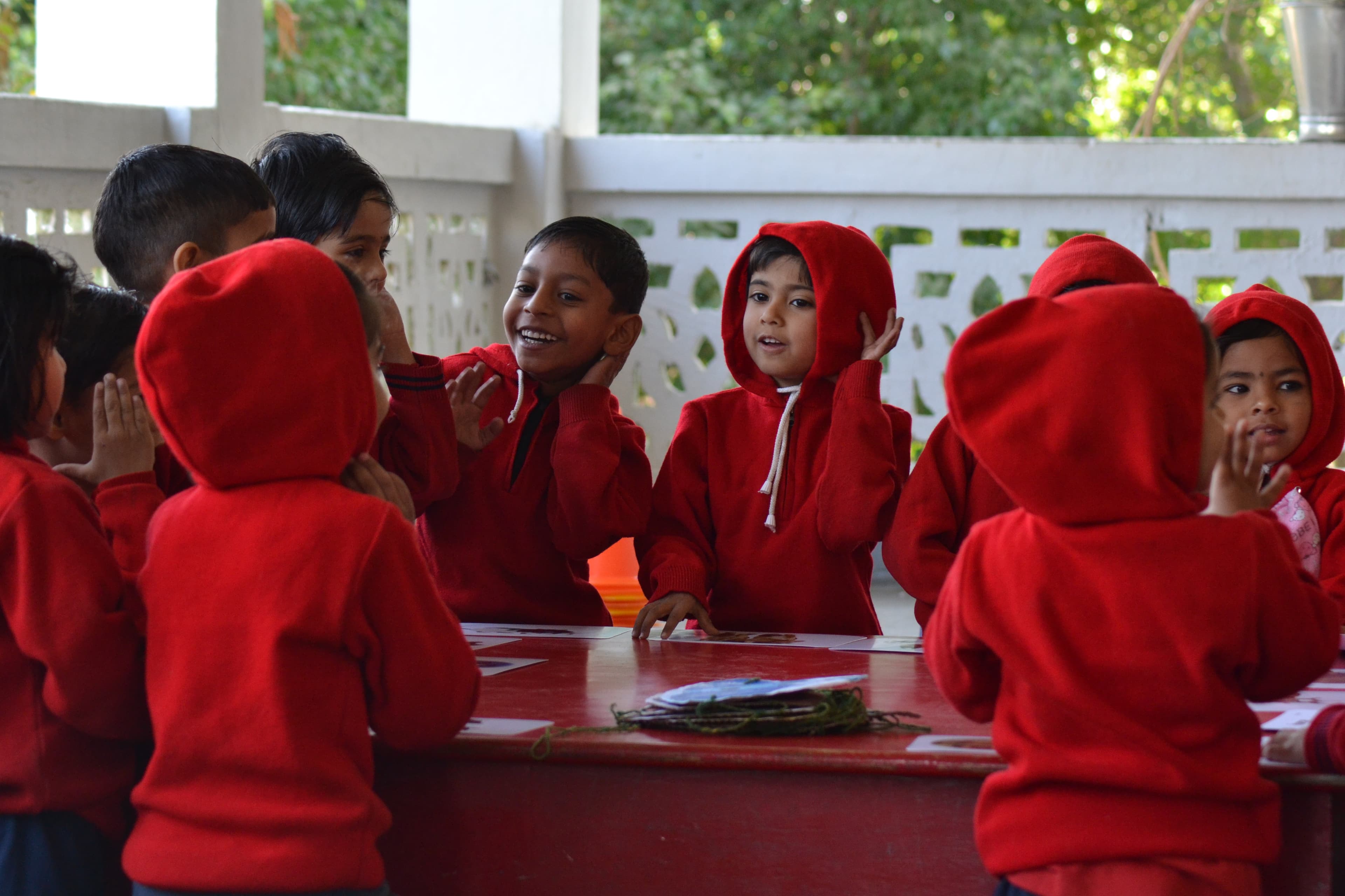Realistic photo of a diverse group of high school students studying together in a modern library, smiling, high quality