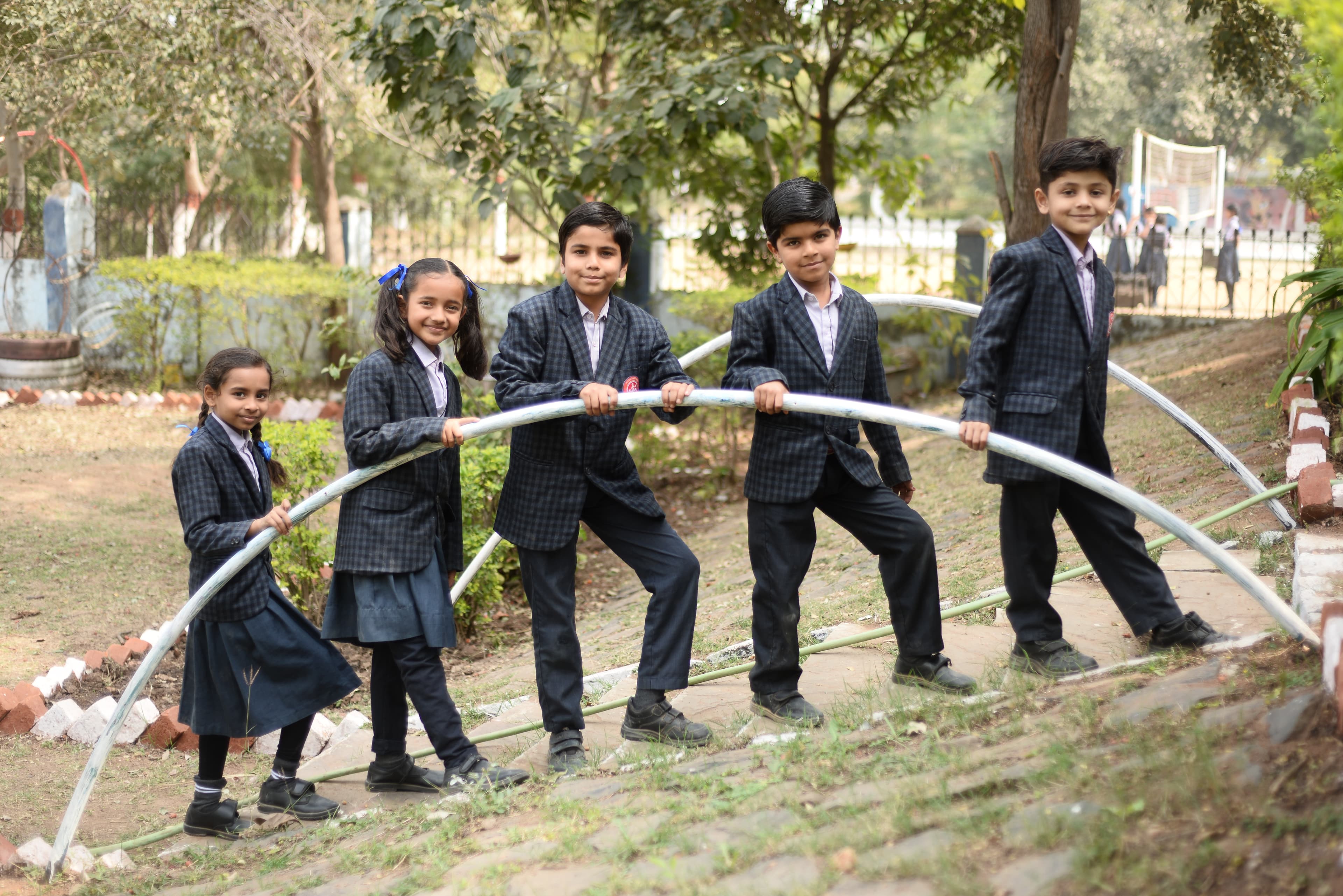 Students looking at a globe representing global vision